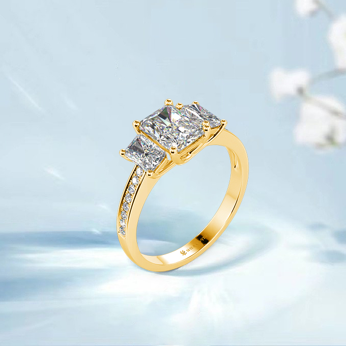 emerald three-stone engagement ring
