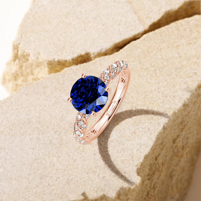 round-cut side stone engagement ring