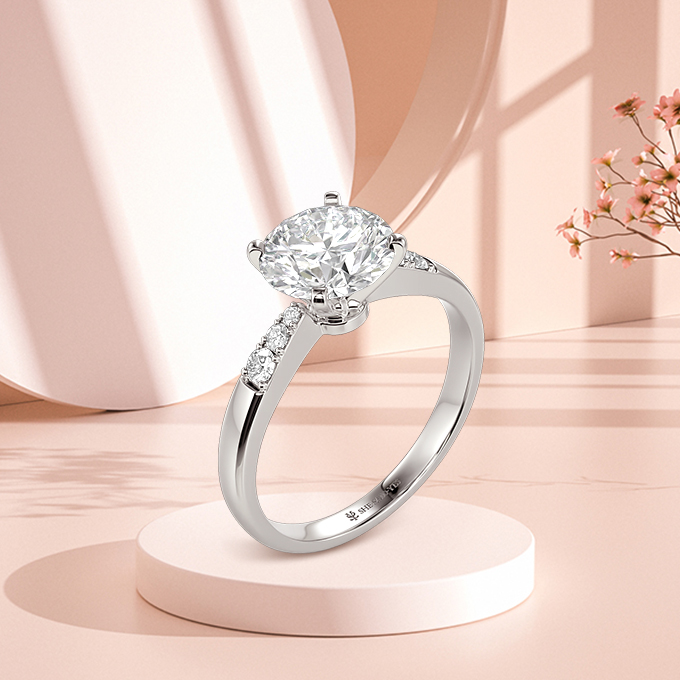 1.5ct  round-cut side stone engagement ring