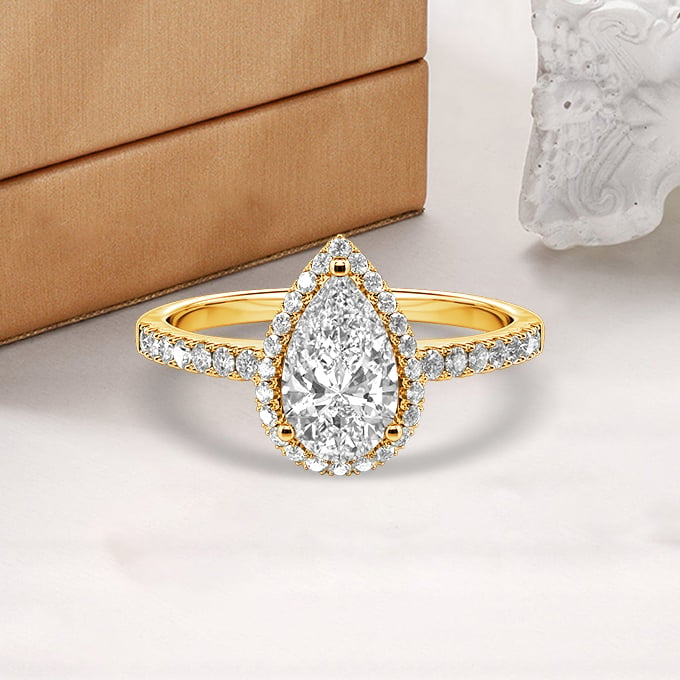 pear-cut halo engagement ring