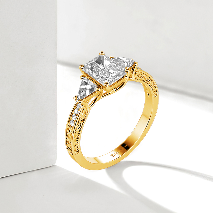 vintage emerald three-stone engagement ring