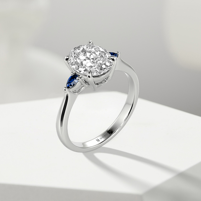 oval-cut three-stone engagement ring