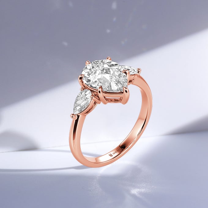 pear three-stone engagement ring