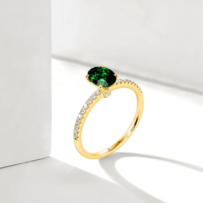 oval-cut side-stone ring