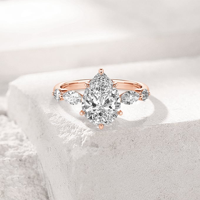 pear-cut side stone engagement ring