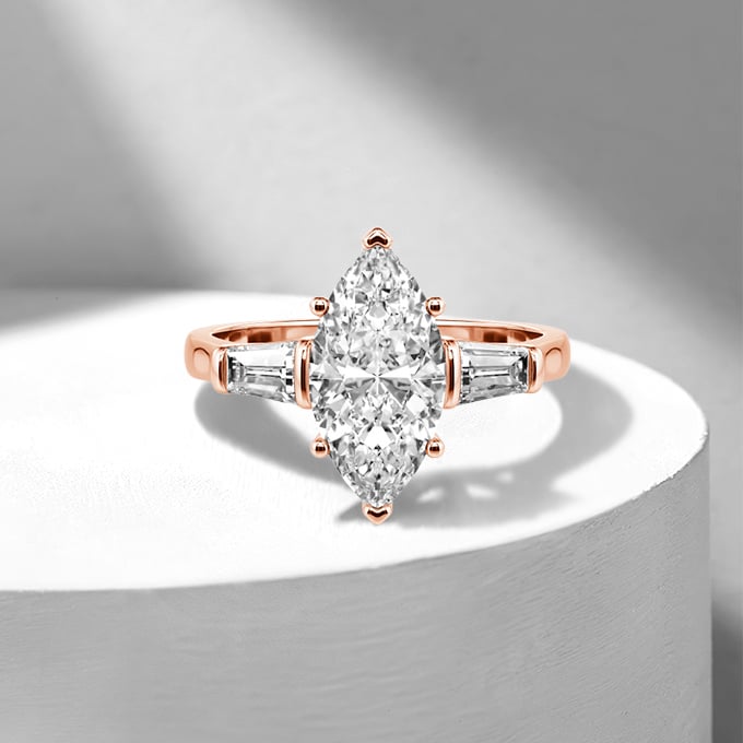 marquise-cut three-stone engagement ring