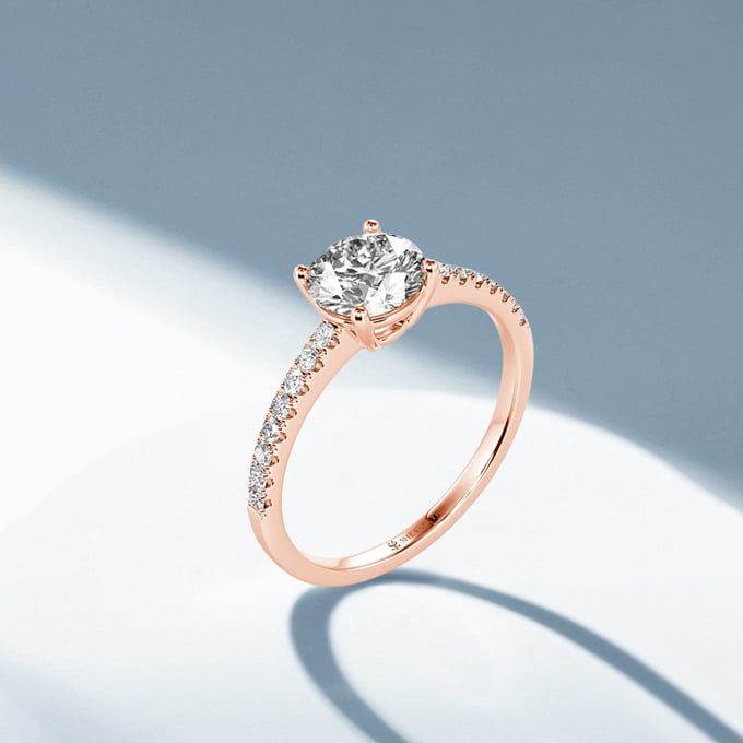 round side-stone engagement ring