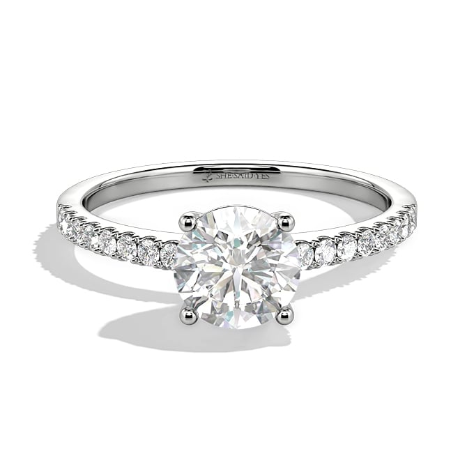 round-cut side stone engagement ring