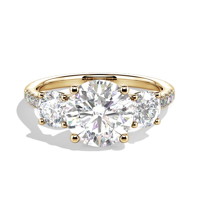 round-cut three stone engagement ring