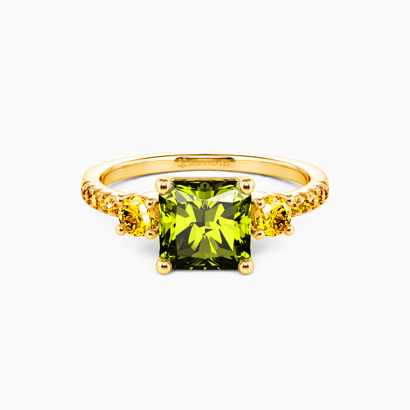three-stone engagement ring with peridot and yellow gemstones