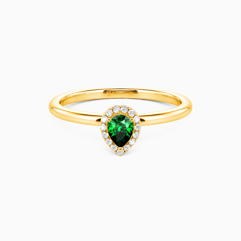 halo ring with emerald green gemstone