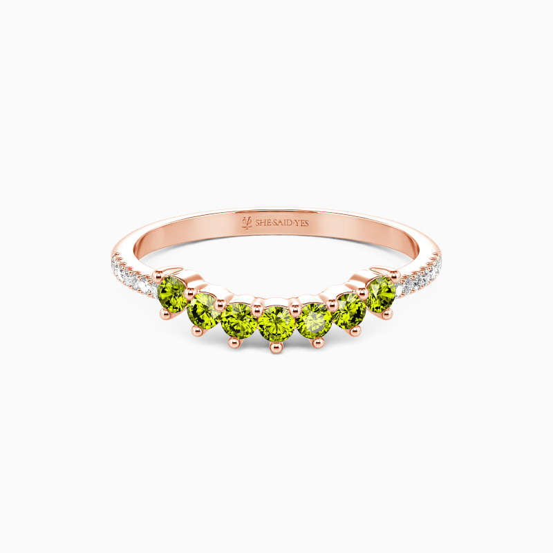 curved wedding band with peridots