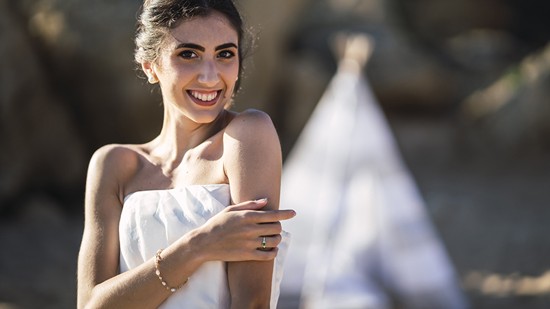 Bohemian bride with peridot three-stone engagement ring