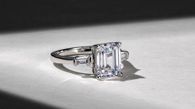 emerald-cut three-stone engagement ring