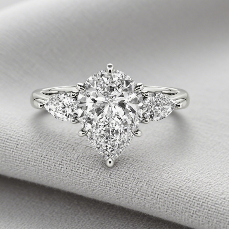 Pear Cut Three Stone Engagement Ring