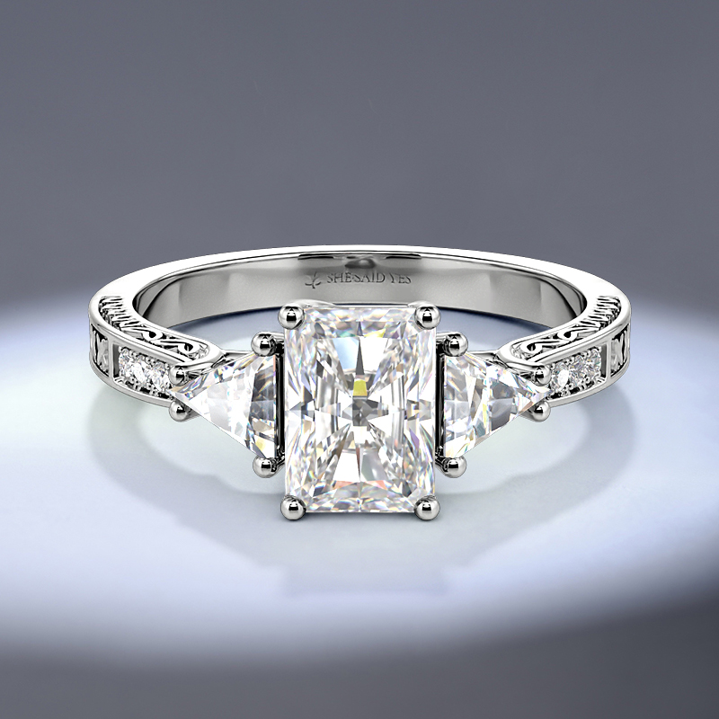 vintage-inspired three-stone ring with carving band
