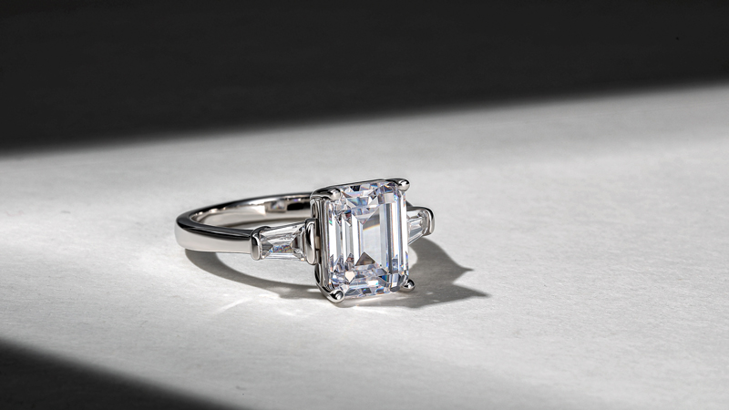 EMERALD-CUT THREE-STONE RING