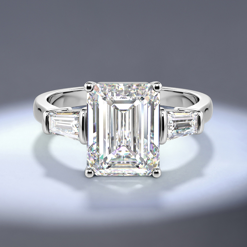 emerald-cut three-stone engagement ring