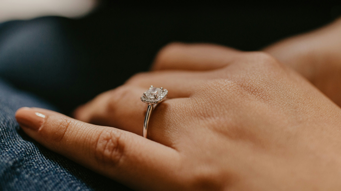 an engagement ring worn on the ring finger of left hand