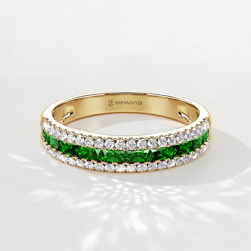 half eternity band with emerald green gemstones