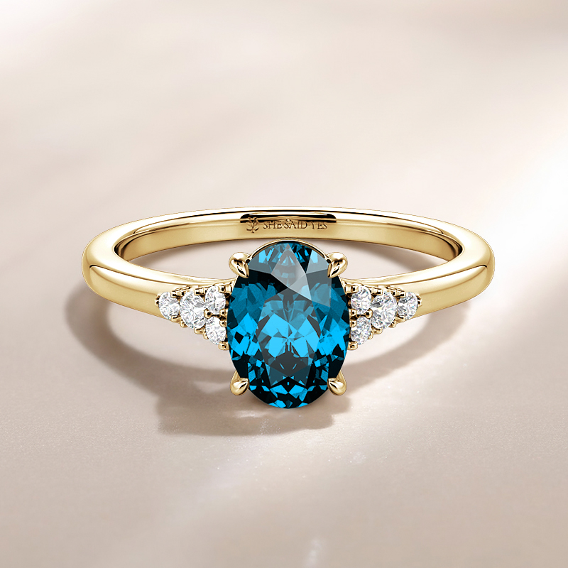 oval-cut side-stone engagement ring