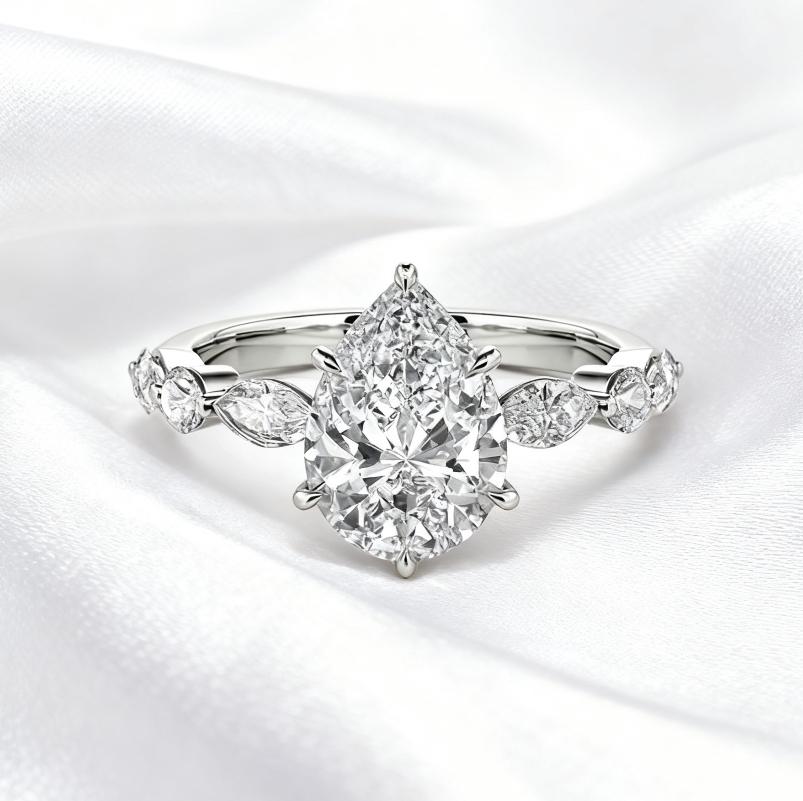 Pear Cut Side Stone Engagement Ring