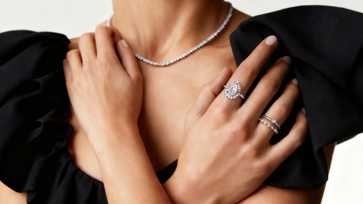 A woman wearing a minimalist & luxury rings