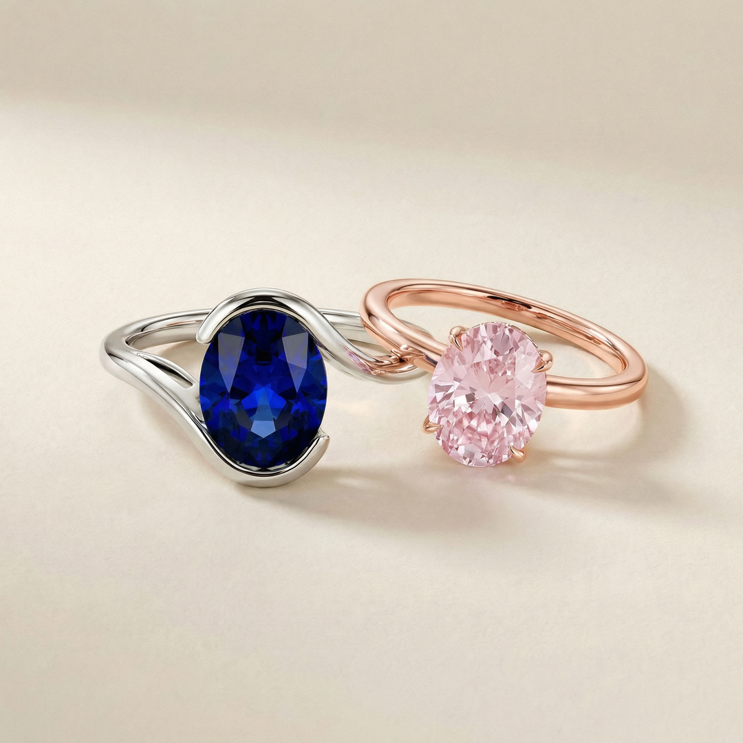 blue sapphire engagement ring in white gold setting & pink sapphire engagement ring in rose gold setting
