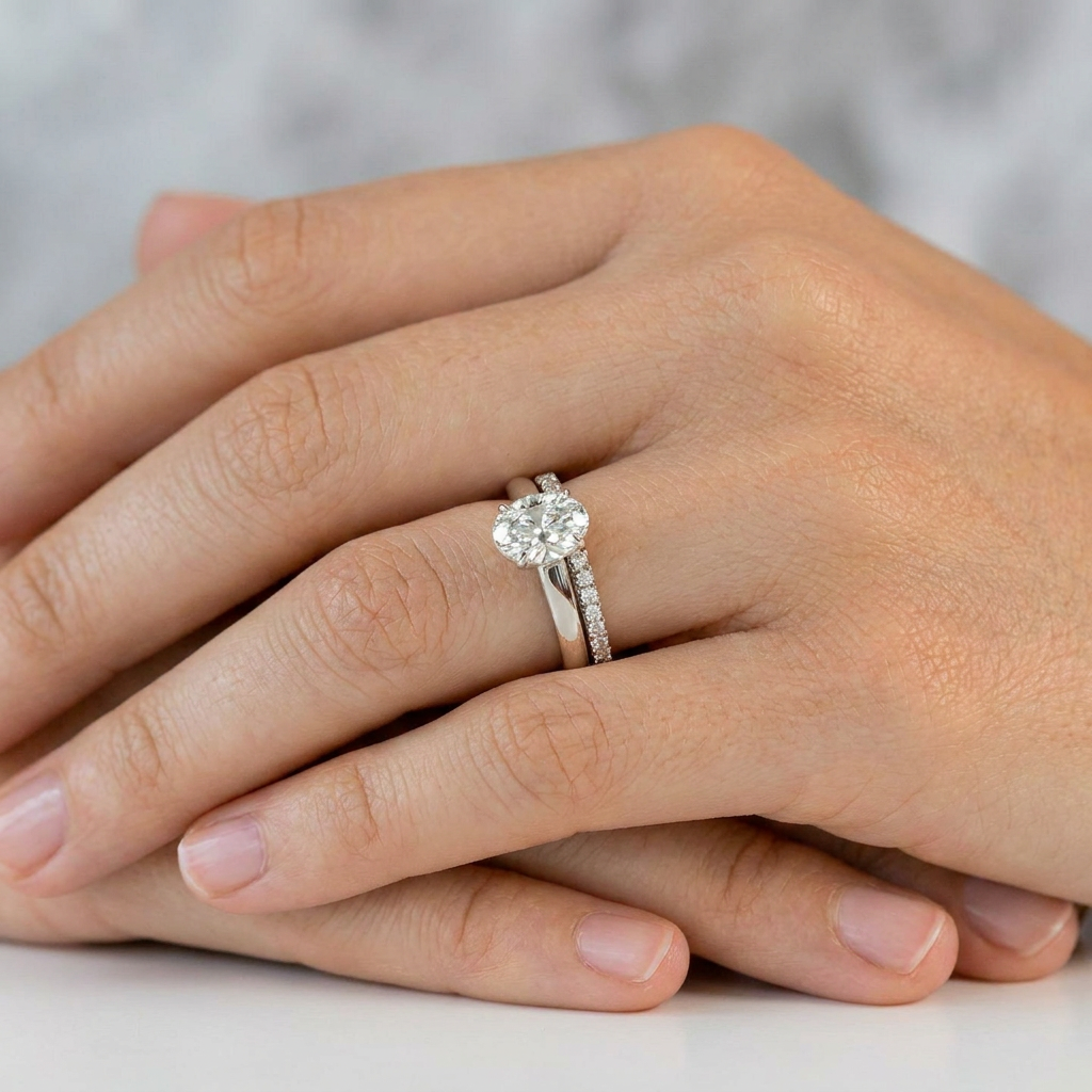 engagement ring and wedding band stacked on left ring finger
