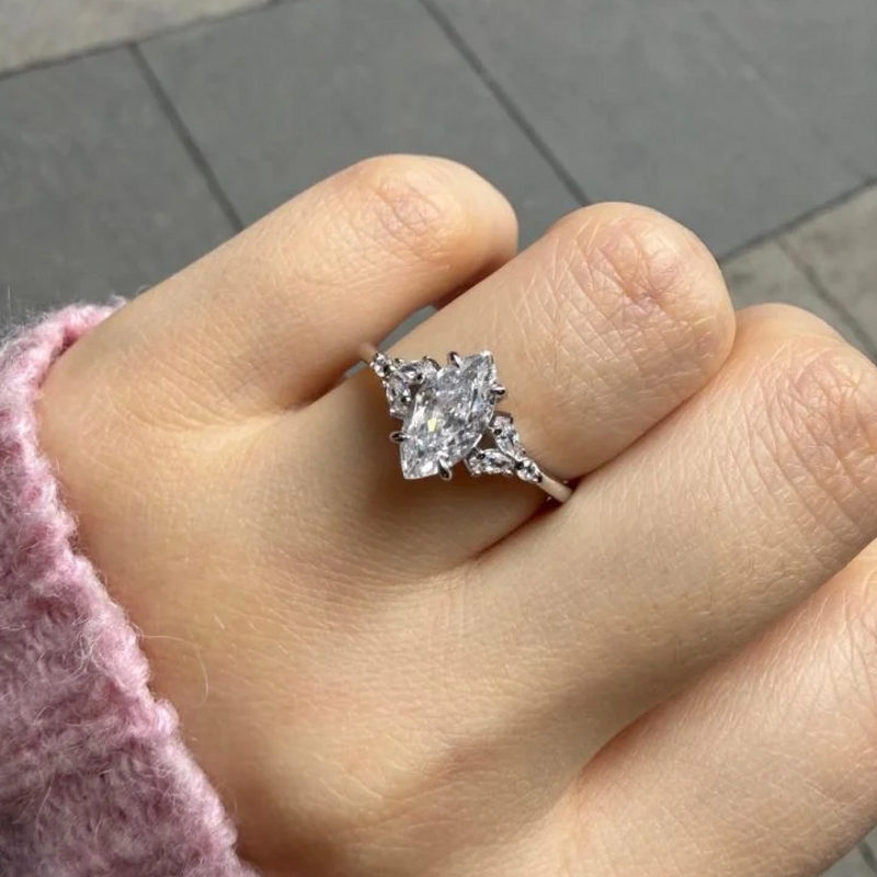Marquise cut diamond engagement ring on hand