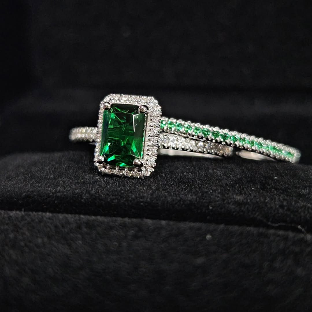 vivid green emerald engagement ring close-up in white gold