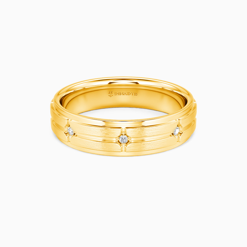 gold wedding band with moissanite