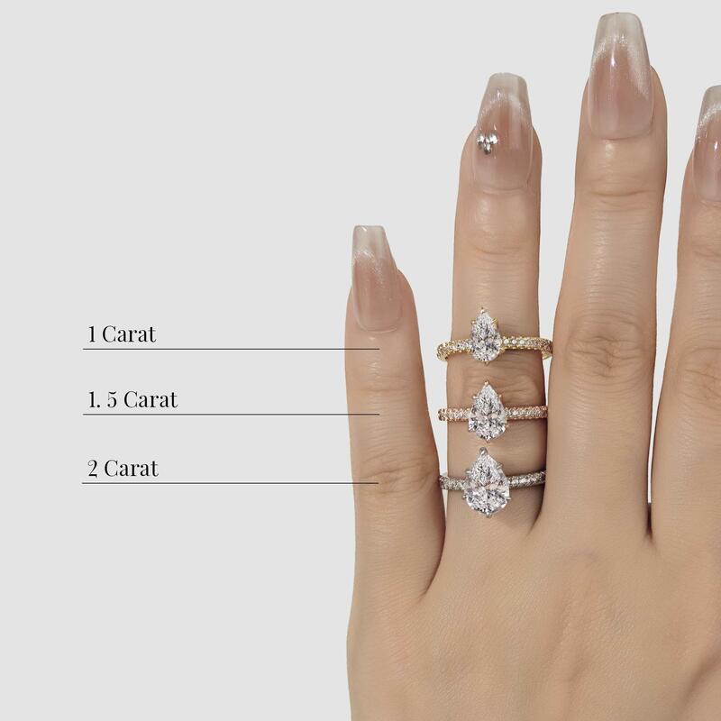 Hand comparison of 1, 1.5, 2 carat pear‑shaped diamond engagement rings