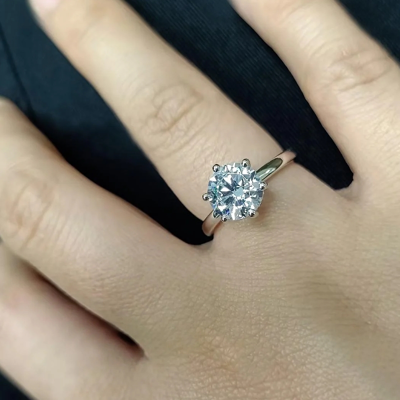 1.5 carat round solitaire engagement ring worn on hand