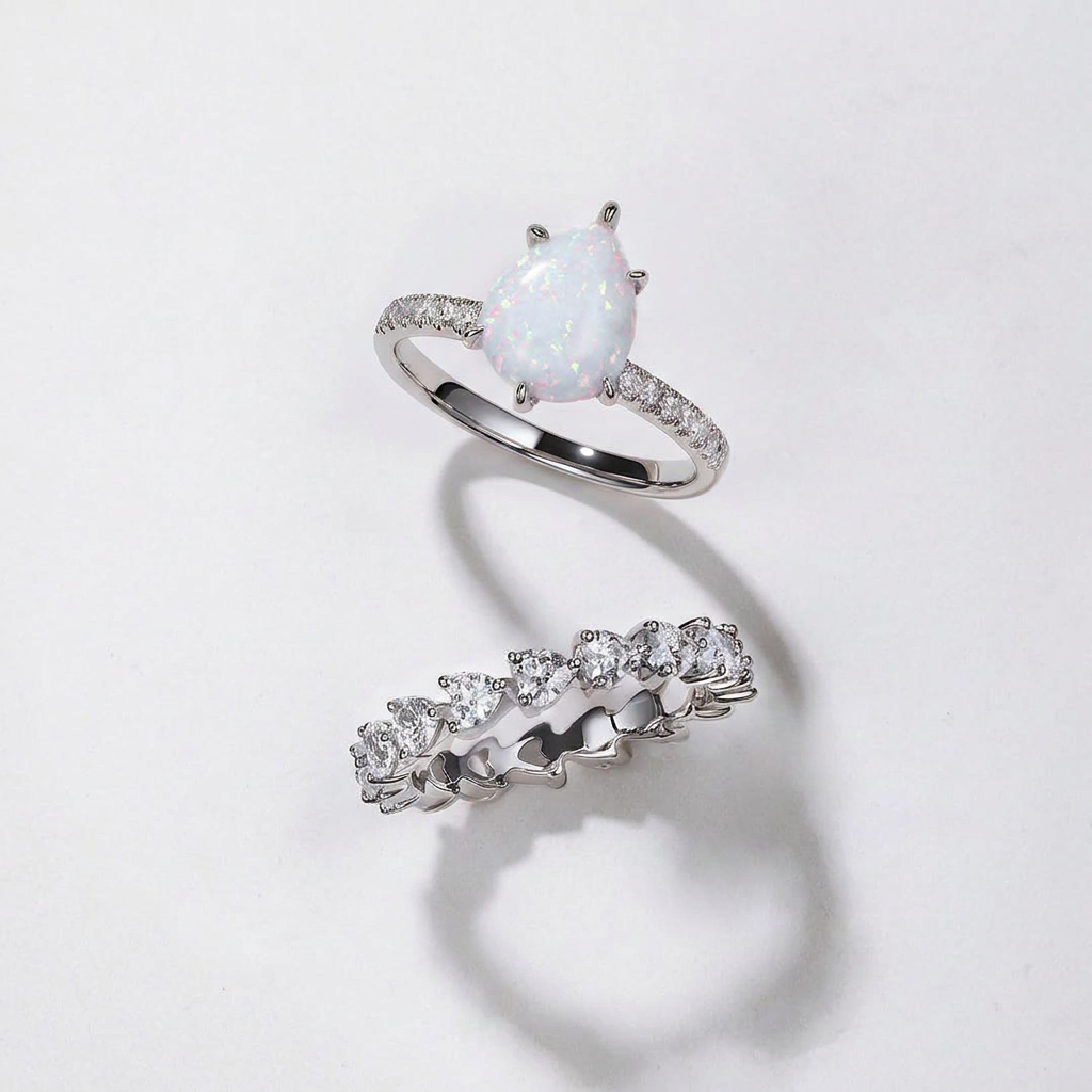 Pear-shaped opal engagement ring and matching wedding band